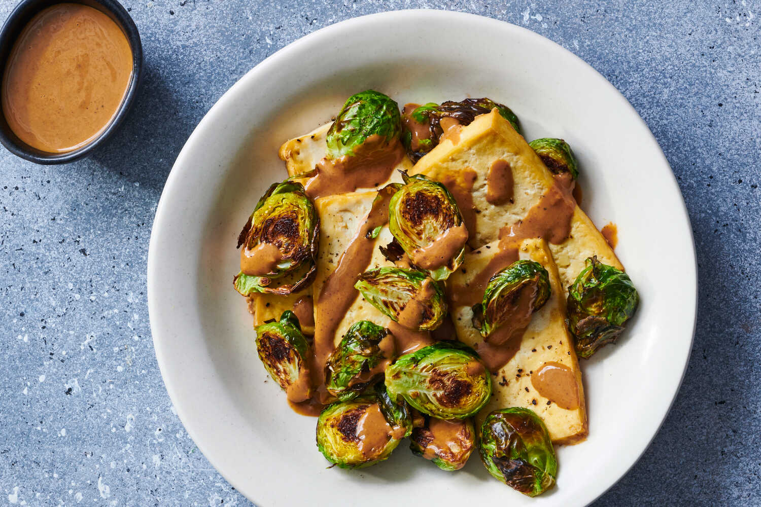 Sheet-Pan Tofu And Brussels Sprouts With Hoisin-Tahini Sauce Recipe | Recipe Cloud App